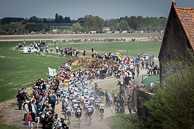 2014 Paris-Roubaix. The Peloton race across the Orchies Pave Secteur